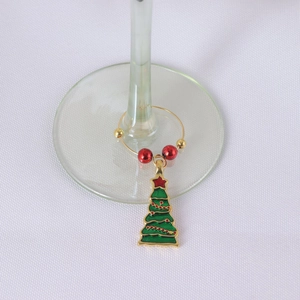 Christmas tree wine glass charm with green enamel and gold ring on glass base