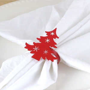 Red Christmas tree napkin ring with star cutouts for festive metal holiday table decor