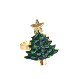 Golden Christmas tree napkin ring with green enamel finish and star topper on white base