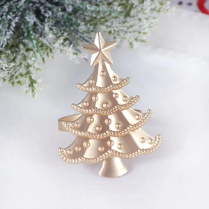 Champagne gold Christmas tree napkin ring with embossed star and matte texture decor