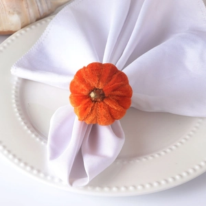 Orange velvet pumpkin napkin ring with gold stem for Halloween and autumn table decor