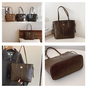 Detailed close-up of large capacity vintage tote bags with metallic accents and side drawstrings
