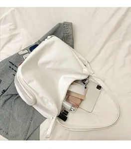Internal view of a spacious white tote bag showing large capacity for tablet and cosmetics