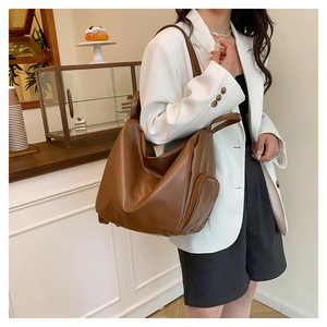 Brown pleated large tote bag with wide strap and side zipper detail for daily use