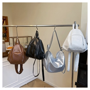 Collection of minimalist leather backpacks and shoulder bags in multiple colors for daily use