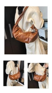 Detail of soft caramel leather dumpling bag with wide knotted strap and glossy finish