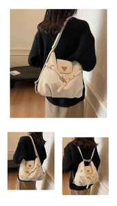 Detail of cream white leather bag showing adjustable straps for shoulder or backpack use