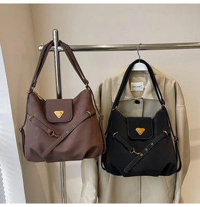 Detailed comparison of vintage leather tote bags in black and brown with metal accents