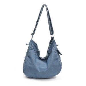 Denim blue hobo shoulder bag with adjustable strap and side pocket in vintage style