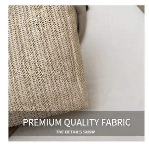 Detailed view of high-density herringbone woven texture on a beige straw bucket bag
