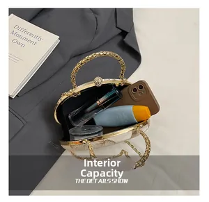 Internal capacity of ball clutch bag showing space for phone and makeup accessories
