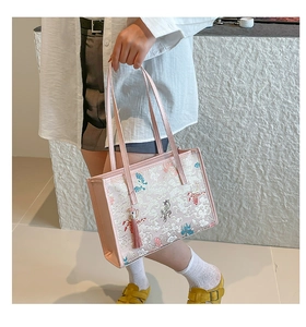 Close-up of pink tote bag featuring exquisite butterfly and cloud jacquard embroidery
