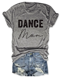 Flat lay of gray DANCE MOM t-shirt paired with distressed blue denim shorts