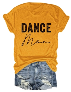 Detail of a yellow Dance Mom T-shirt paired with distressed denim shorts on white background