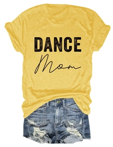 Flat lay detail of mustard yellow DANCE MOM t-shirt paired with distressed denim shorts