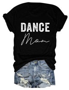 Flat lay of a black Dance Mom cotton t-shirt paired with distressed denim blue shorts