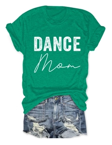 Detailed flat lay of a green Dance Mom graphic t-shirt and distressed denim shorts