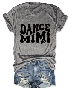 Detailed flat lay of round neck grey t-shirt with graphic print and ripped denim shorts