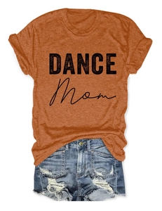 Flat lay of an orange cotton t-shirt with DANCE MOM print and distressed denim shorts set