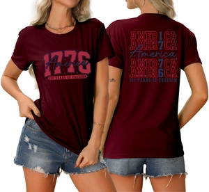 Detail of 1776 America vintage print on both sides of a burgundy cotton t-shirt