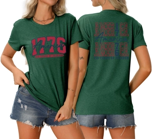 Close-up of vintage 1776 America 250 Years of Freedom print on dark green t-shirt