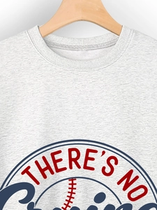 Close-up of light gray crewneck sweatshirt with baseball themed graphic and lettering