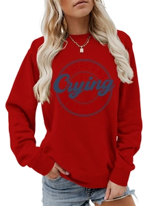 Detail of red crewneck sweatshirt featuring There's No Crying In Baseball printed graphic