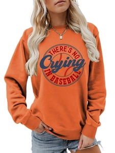 Detailed view of an orange sweatshirt with 'No Crying In Baseball' slogan and soft knit texture