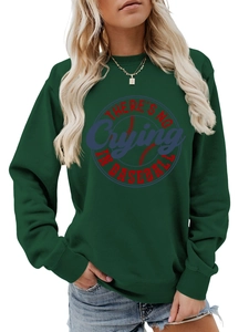 Detail of dark green sweatshirt featuring rib-knit cuffs and baseball slogan print
