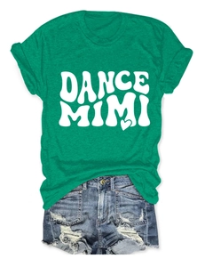 Close-up of a green cotton t-shirt featuring a white DANCE MIMI print and a small heart