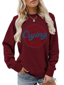 Close-up of burgundy sweatshirt with vintage Baseball circular logo and ribbed cuffs