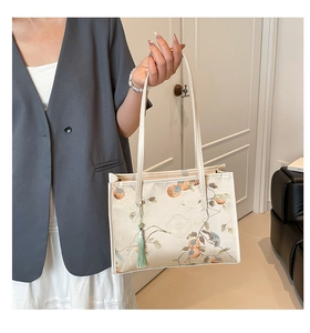 Detail of New Chinese style tote bag with persimmon embroidery and green tassel ornament