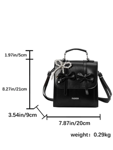 Mini sac à dos en cuir noir avec nœuds et dimensions précises pour un style quotidien