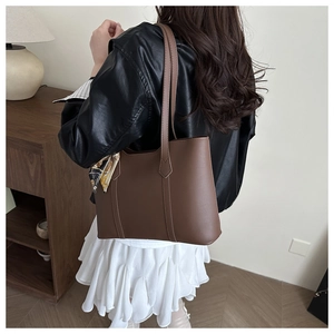 Brown leather tote bag with printed silk scarf detail and slim shoulder straps