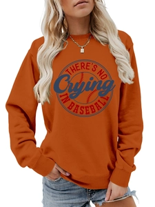 Detailed view of orange crewneck sweatshirt featuring There's No Crying In Baseball graphic