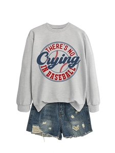 Flat lay of gray cotton sweatshirt with baseball slogan and distressed denim shorts