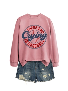 Detailed flat lay of pink baseball sweatshirt and distressed denim shorts on white background