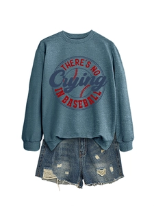 Detail of grey-blue sweatshirt with baseball text and distressed denim shorts