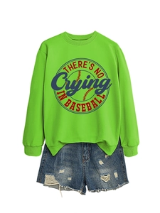 Detail view of neon green sweatshirt with baseball print and distressed denim shorts