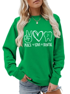 Detail of Peace Love Dental print on bright green long sleeve crewneck sweatshirt