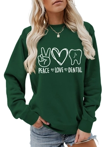 Detail view of the ribbed cuffs and Peace Love Dental print on this forest green sweatshirt