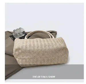 Close-up of the woven straw tote bag base showing durable texture and flat bottom design