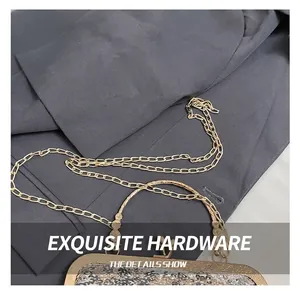 Detailed view of luxury evening bag with gold sequins and durable metal chain hardware