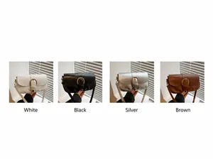 Detailansicht der Vintage-Satteltaschen in Weiß, Schwarz, Silber und Braun mit Ring