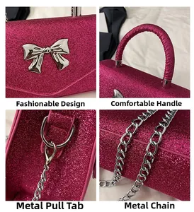 Detail of fuchsia sequin handbag with silver bow decoration and metal chain strap