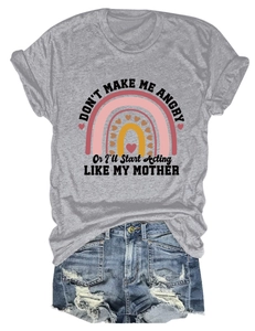 Close-up of rainbow print and humor slogan on grey cotton blend t-shirt with denim shorts