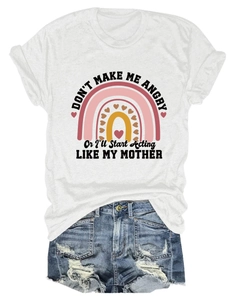 Flat lay of a white cotton t-shirt featuring rainbow print and fun text with denim shorts
