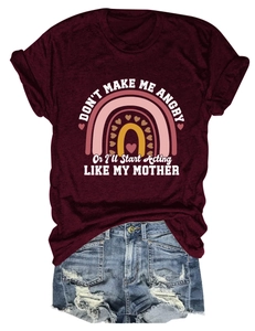 Flat lay of maroon cotton t-shirt with rainbow print and distressed blue denim shorts