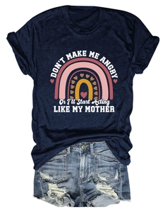 Detail of navy t-shirt with rainbow print and distressed denim shorts flat lay outfit