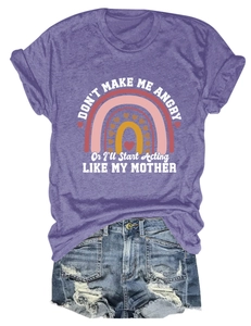 Flat lay of purple cotton T-shirt with humorous slogan and distressed denim shorts